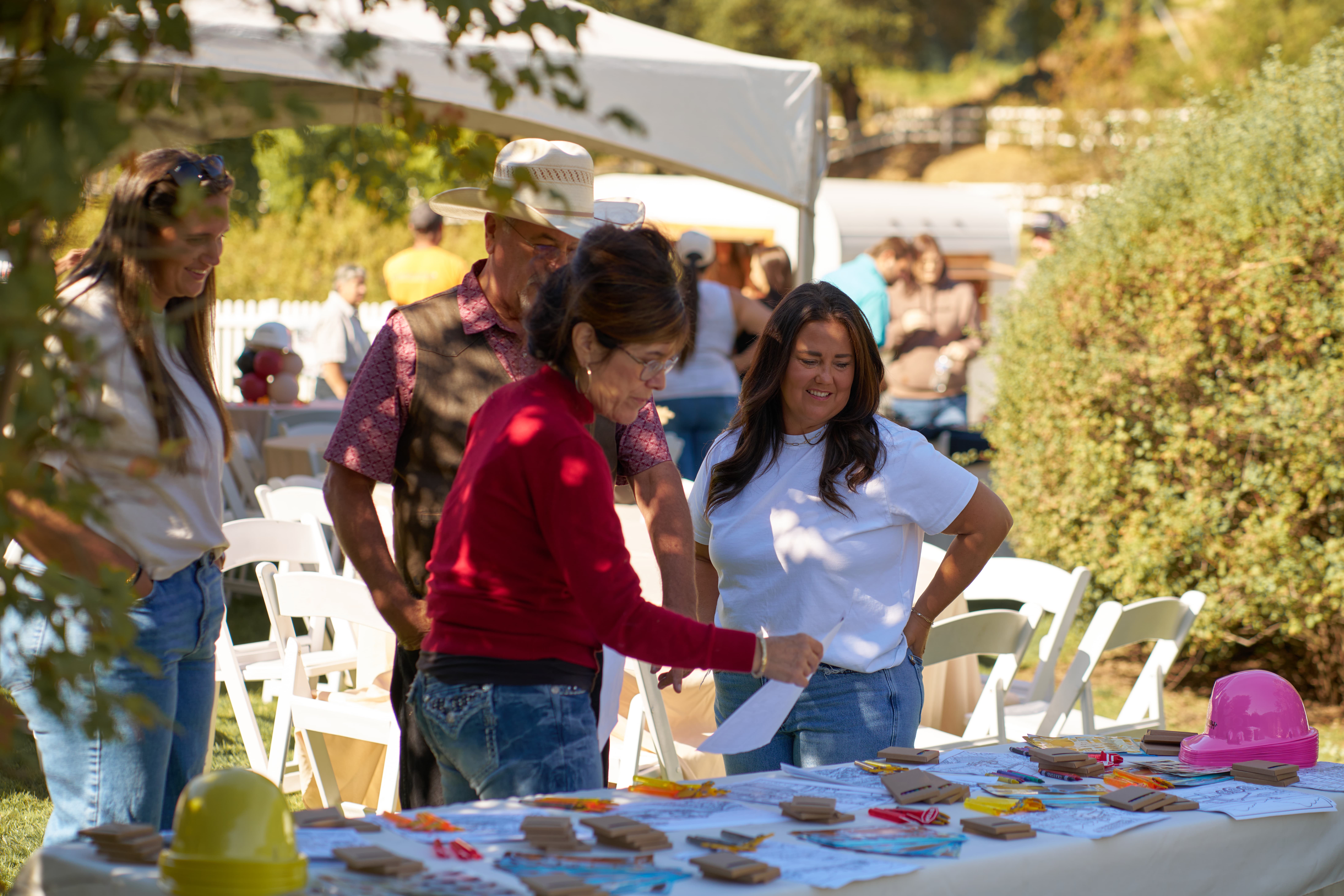 People standing around a table
