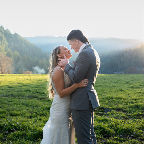 Couple kissing in ope field